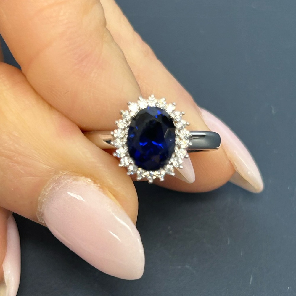 Blue Sapphire Halo Ring with White Stones